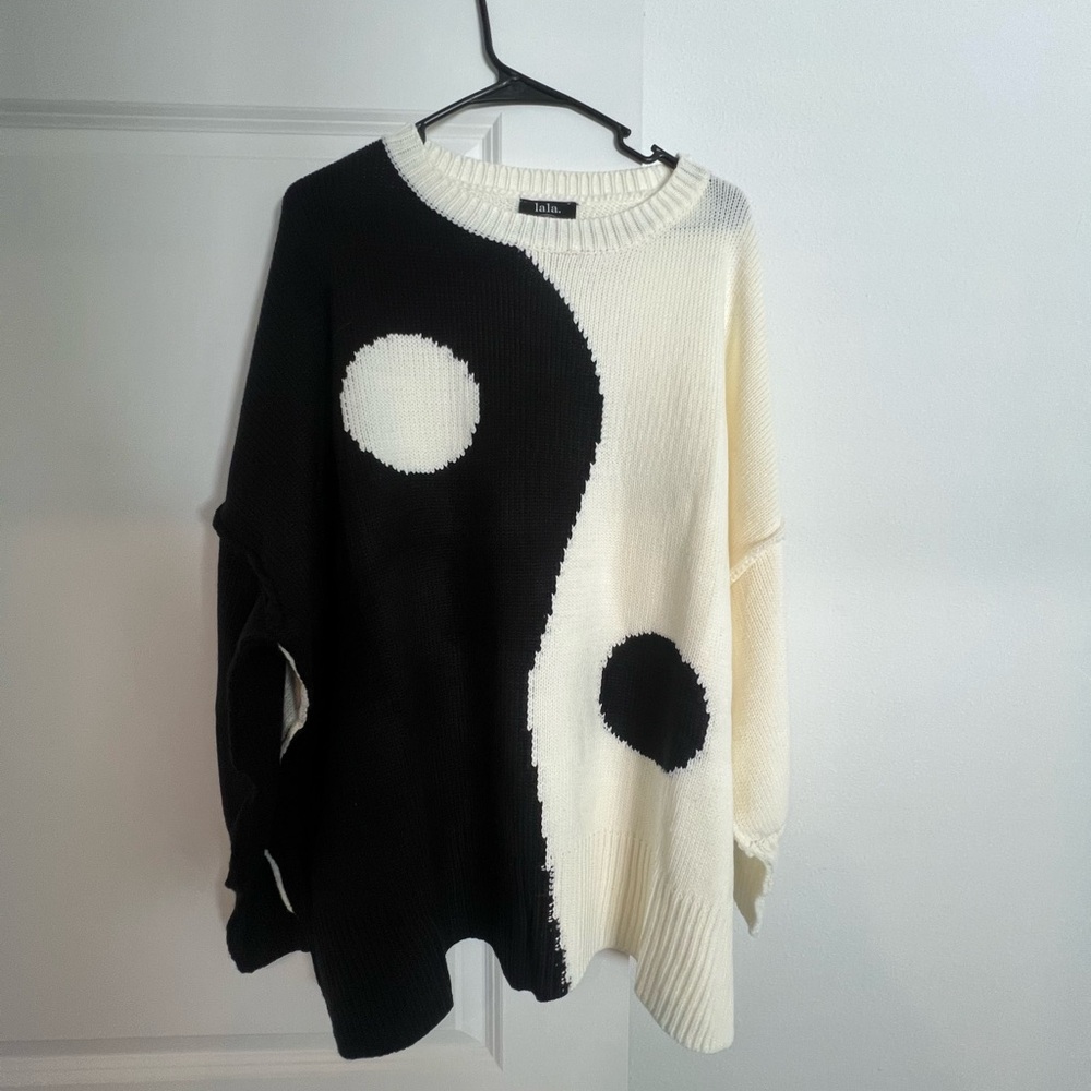 Dressed in LALA Black and White Crew Neck Sweater with Bold Circular Design